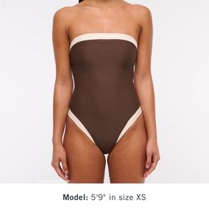 Abercrombie swimsuit.
Brown and Cream Women's Strapless Swimsuit